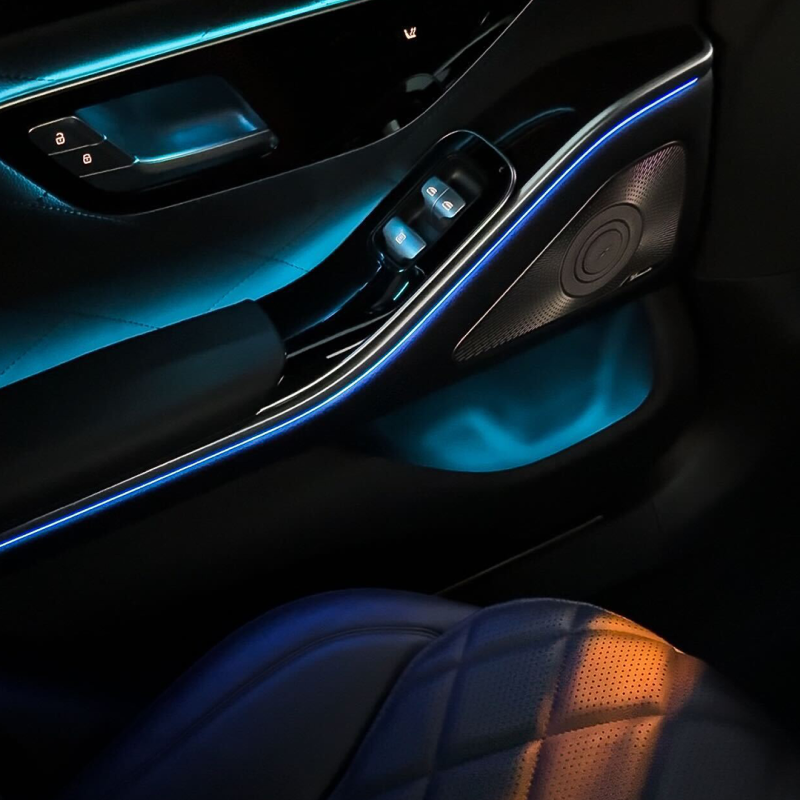 An image that showcases ambient lighting inside a luxury car.
